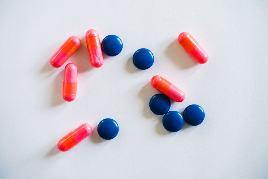 Adderall IR tablets and XR capsules side by side representing the difference between the two formulations