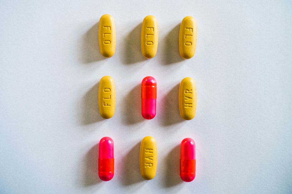 Bottles of oxycodone and codeine pills side by side representing a painkiller comparison