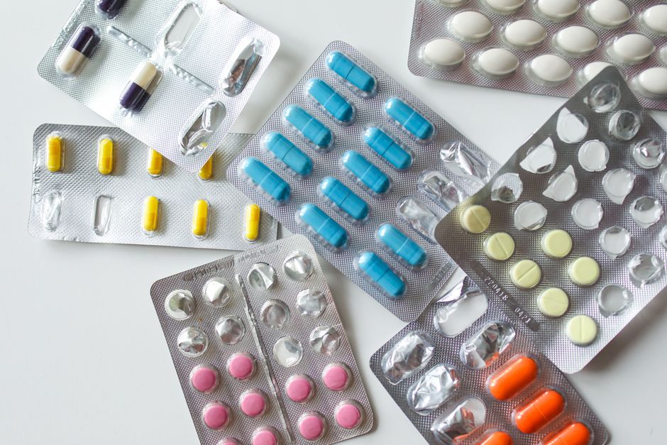Bottles of oxycodone and morphine tablets side by side representing an opioid medication comparison