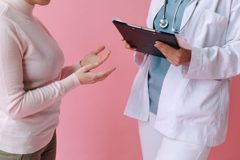 Doctor discussing medication and pain management with a patient during an opioid follow-up appointment
