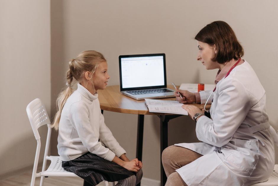 Doctor discussing oxycodone follow-up visit questions with a patient during a consultation