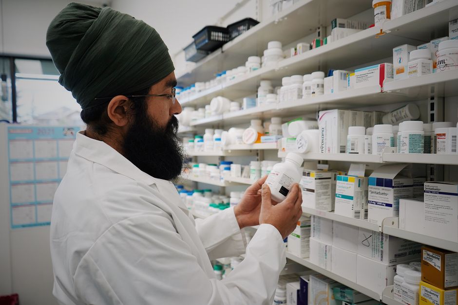 Empty pharmacy shelves illustrating oxycodone medication shortages