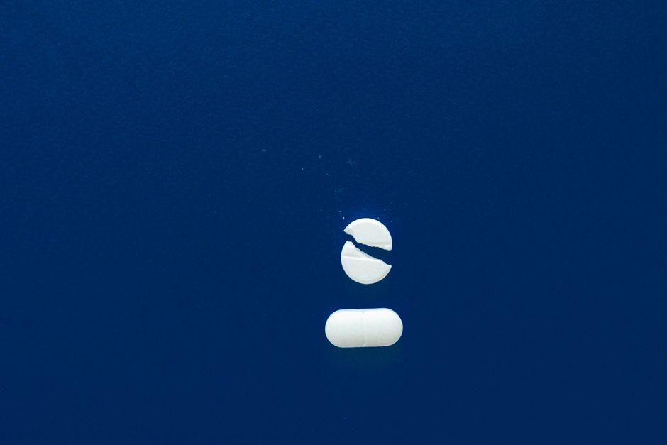 Oxycodone pills next to foods and drinks that should be avoided during treatment
