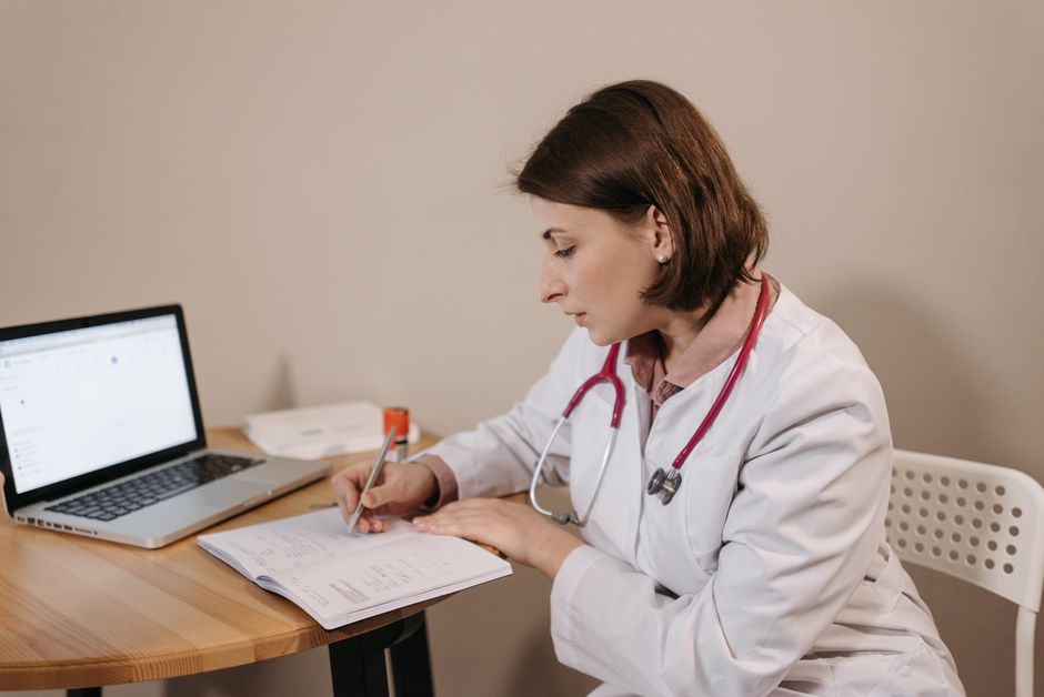 Patient discussing questions to ask before starting Adderall with a doctor during a consultation
