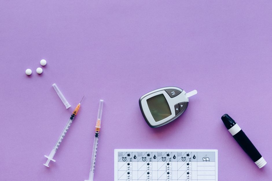 Person checking blood sugar levels with a glucose monitor while taking oxycodone medication