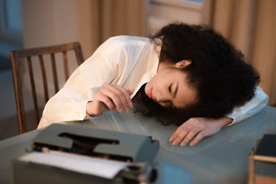 Person experiencing fatigue and mood changes as symptoms of Adderall withdrawal