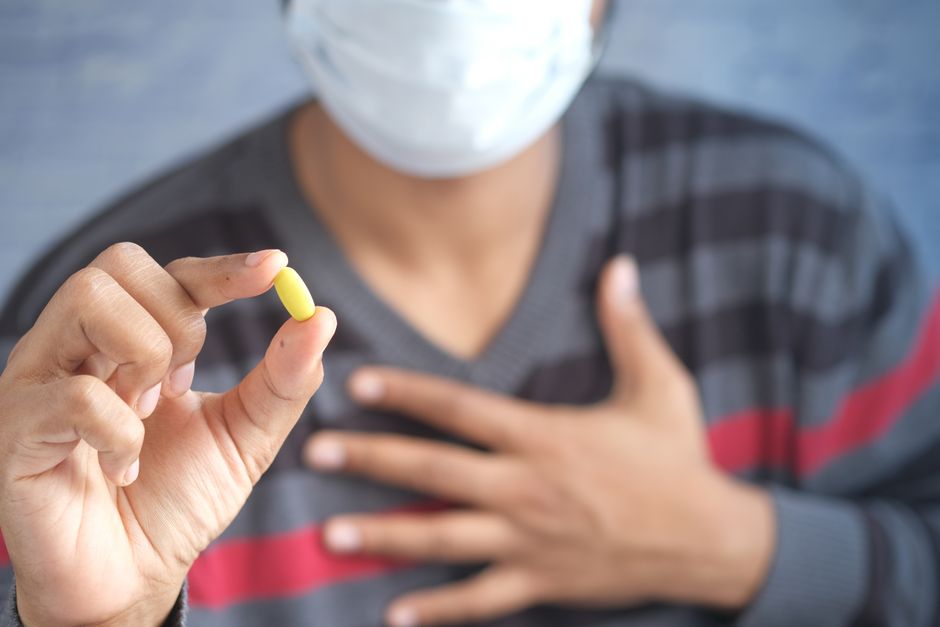 Person experiencing sweating as a side effect of taking oxycodone