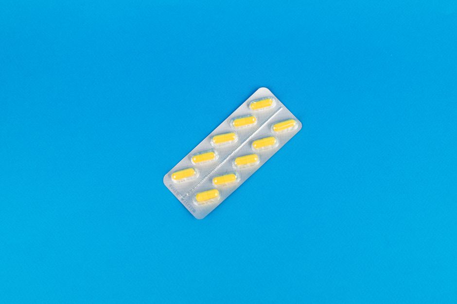 Pharmacist checking empty shelf during an oxycodone shortage at the pharmacy