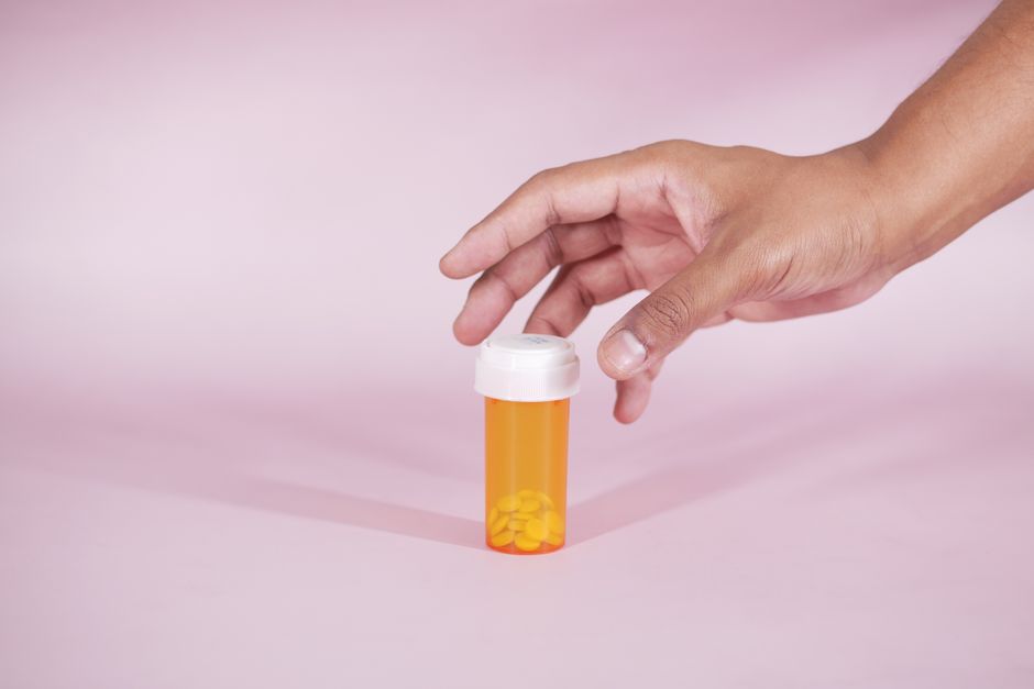 Prescription pill bottles and medications representing oxycodone drug interactions to be aware of