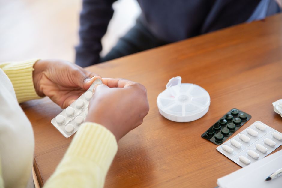 Senior woman living alone managing her oxycodone medication safely at home