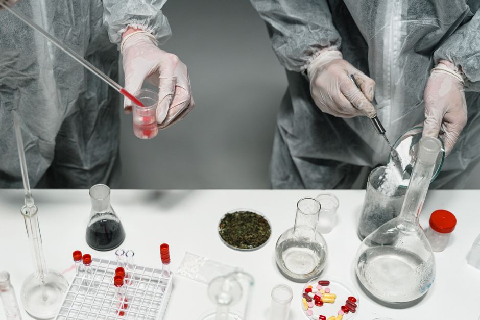 Urine drug test cup used during pain management monitoring appointment