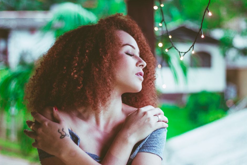 Woman experiencing changing moods throughout the day, reflecting on emotional ups and downs