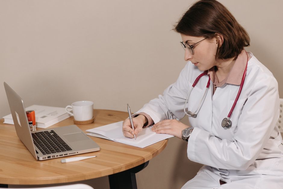 Doctor using a computer to send an electronic prescription for a controlled substance