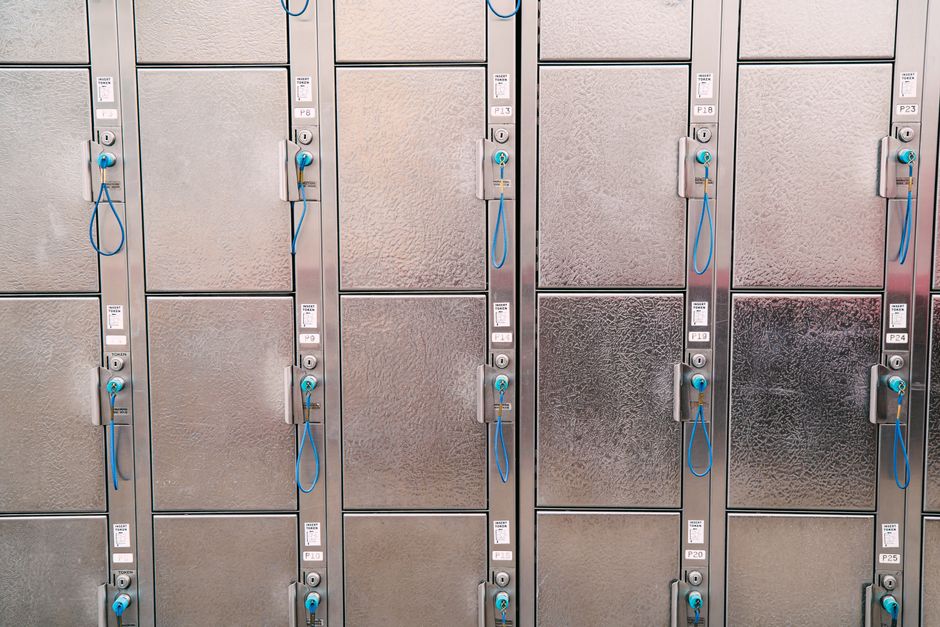 Parent locking a medicine cabinet to keep prescription opioids away from a curious toddler